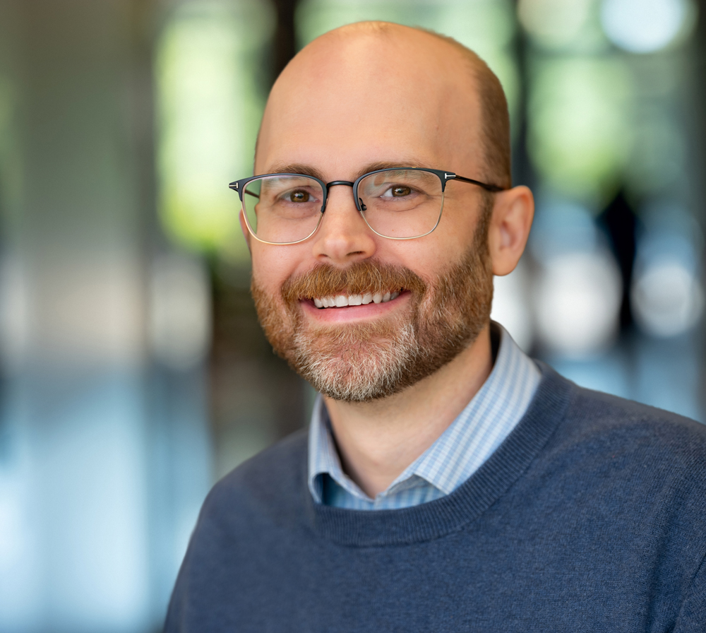 Headshot of Jensen employee Adam Calamar