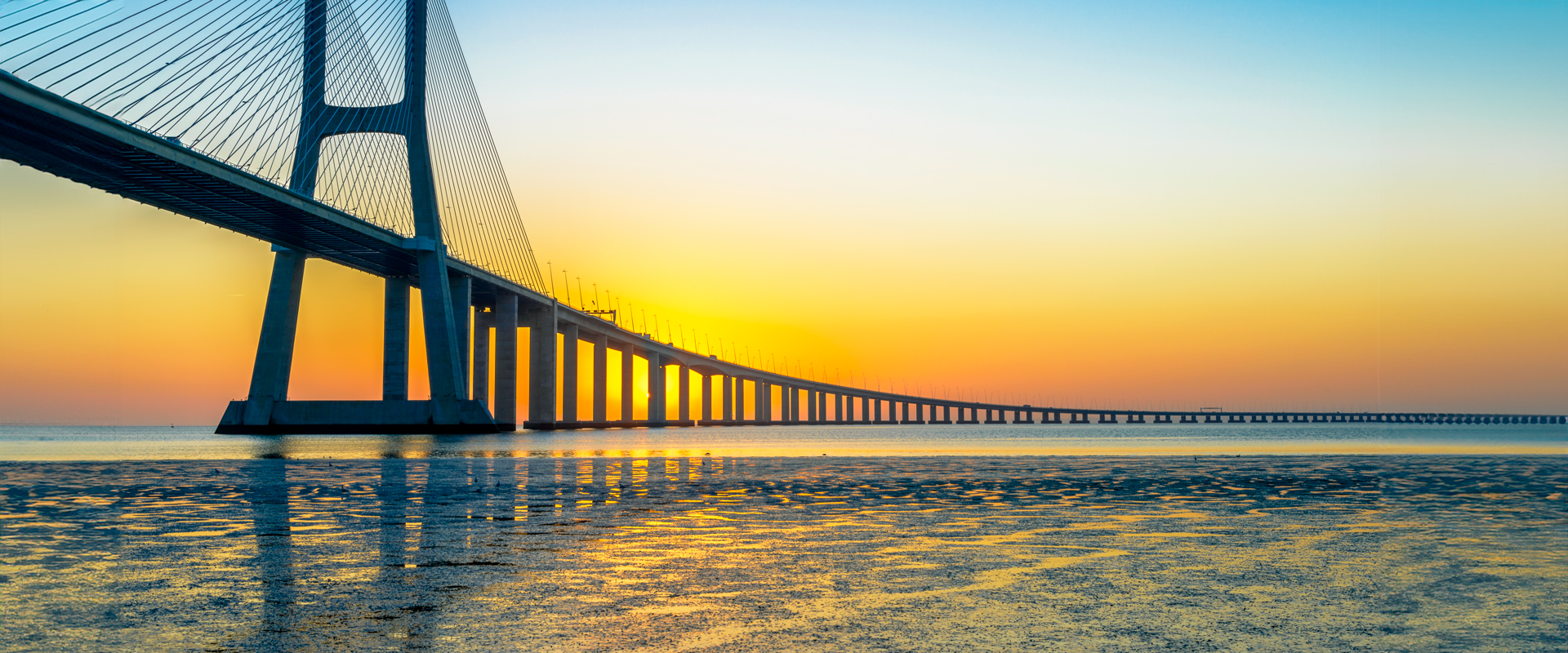 Photo of bridge at sunrise